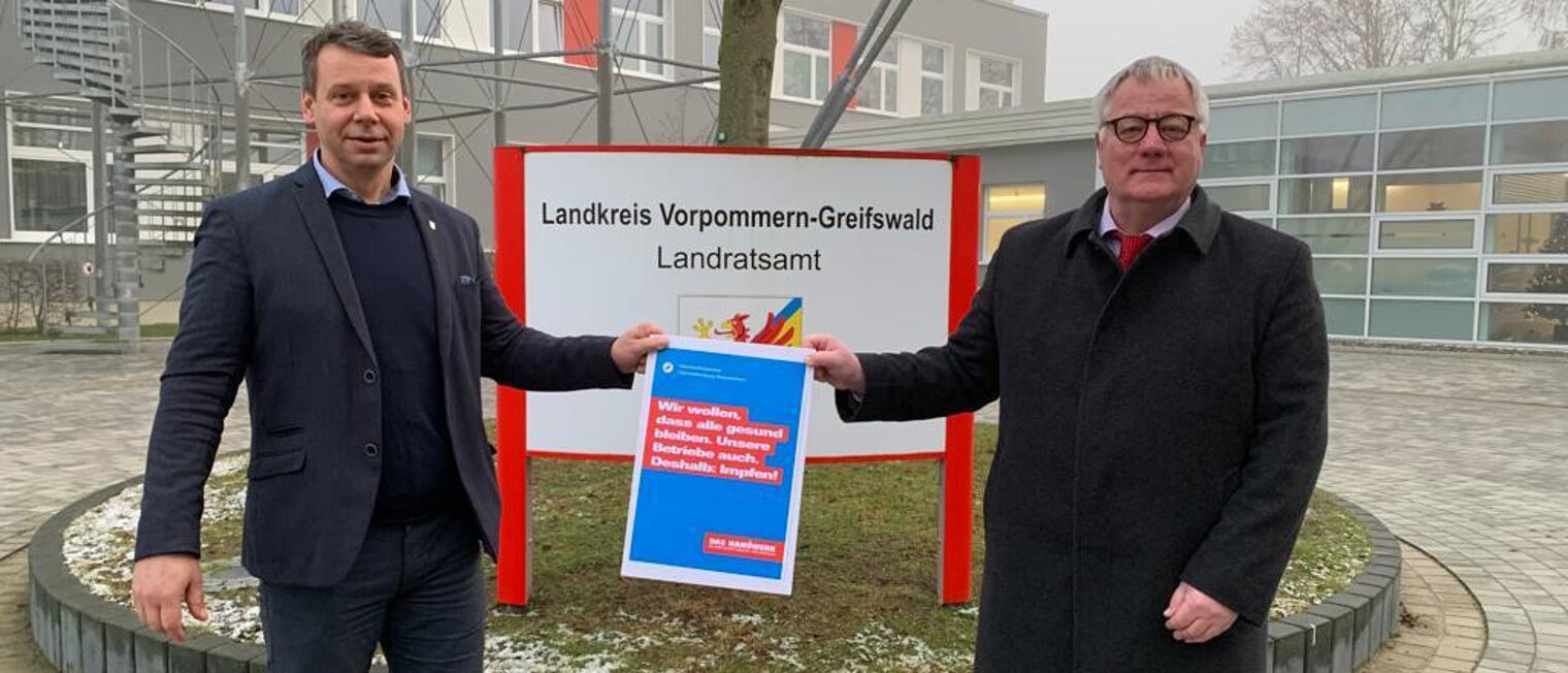 Landrat Michael Sack und Präsident Axel Hochschild